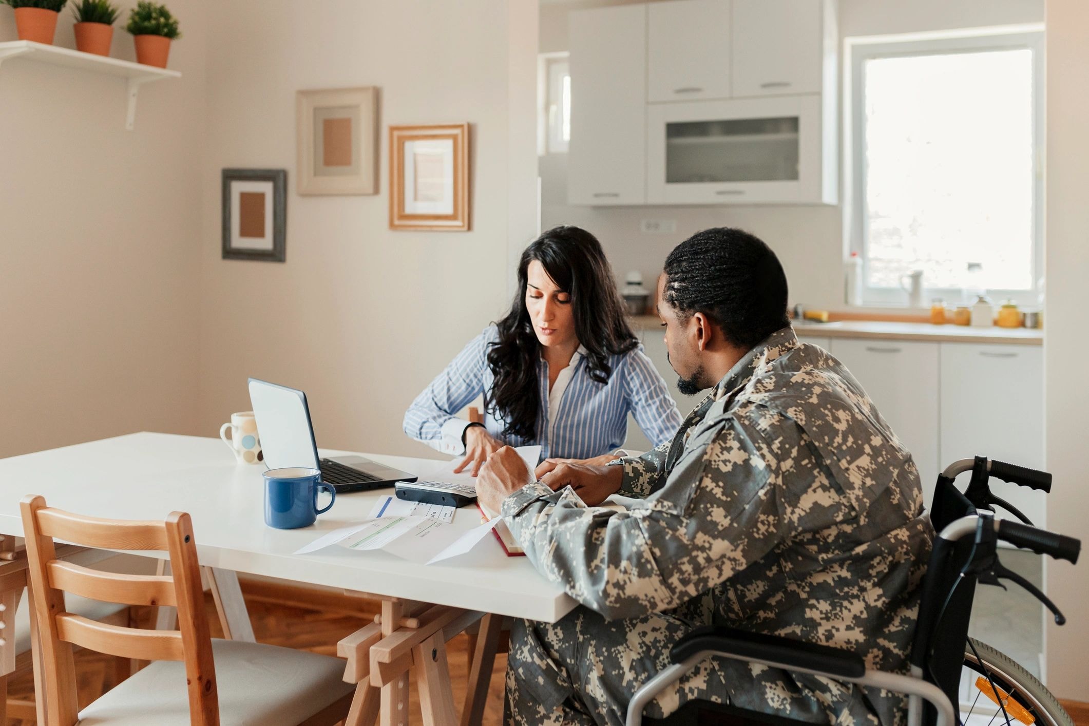 Resident reviewing documents with a support coordinator